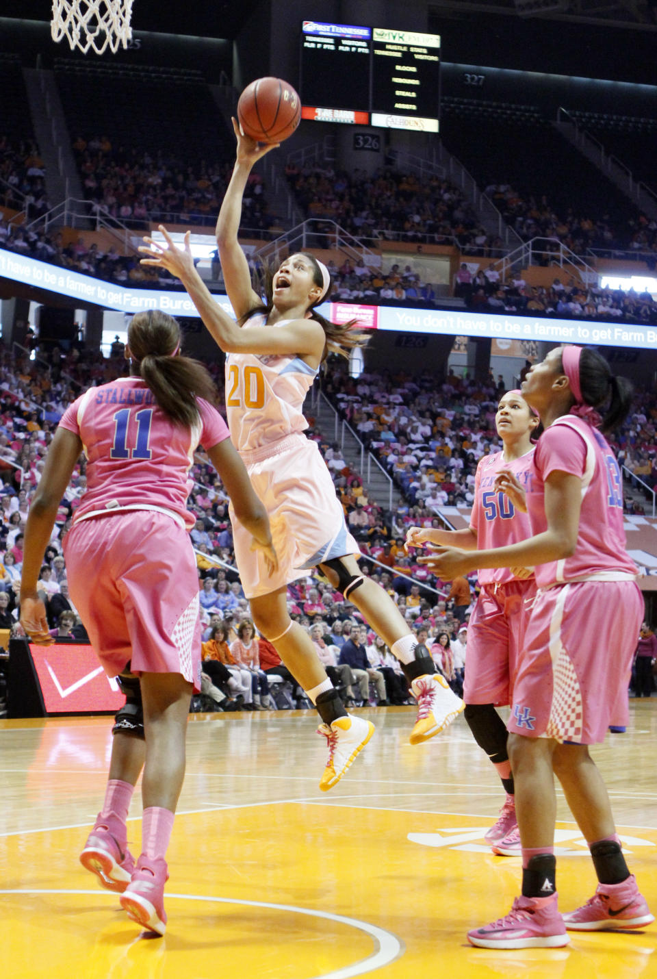 Tennessee center Isabelle Harrison (20) shoots over Kentucky forward DeNesha Stallworth (11) as forward/center Azia Bishop (50) and guard Bria Goss (13) look on in the first half of an NCAA college basketball game on Sunday, Feb. 16, 2014, in Knoxville, Tenn. (AP Photo/Wade Payne)