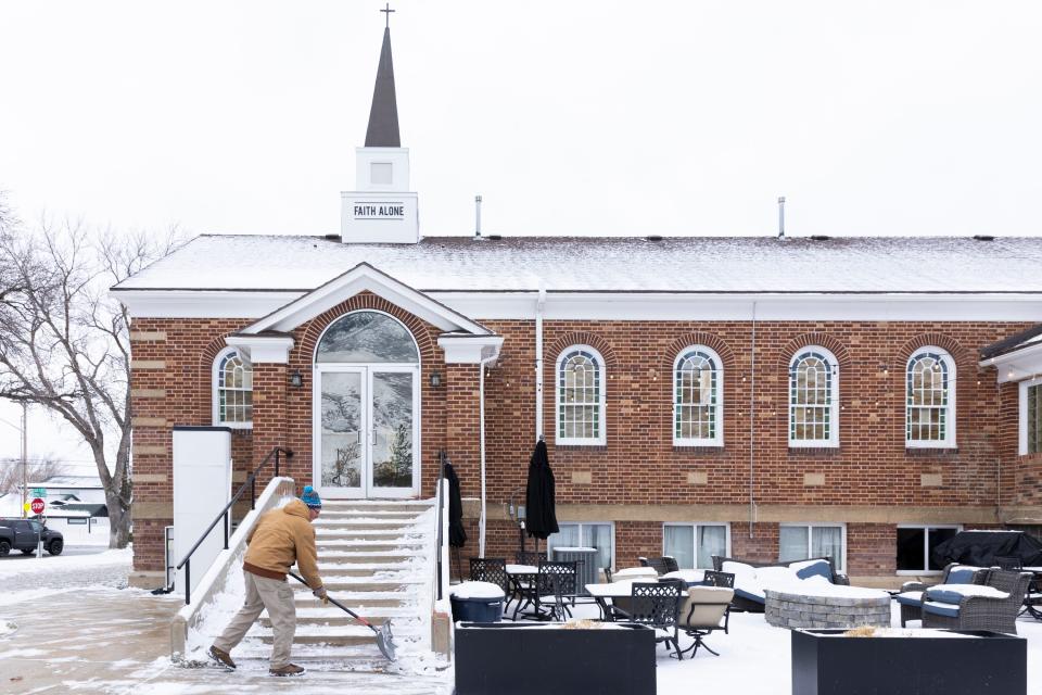 People are pictured shoveling snow after an overnight storm in Draper on Wednesday, Jan. 10, 2024. | Marielle Scott, Deseret News