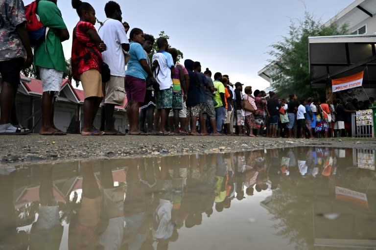 Solomon Islanders queue up to vote outside a polling station in Honiara on Wednesday (Saeed KHAN)