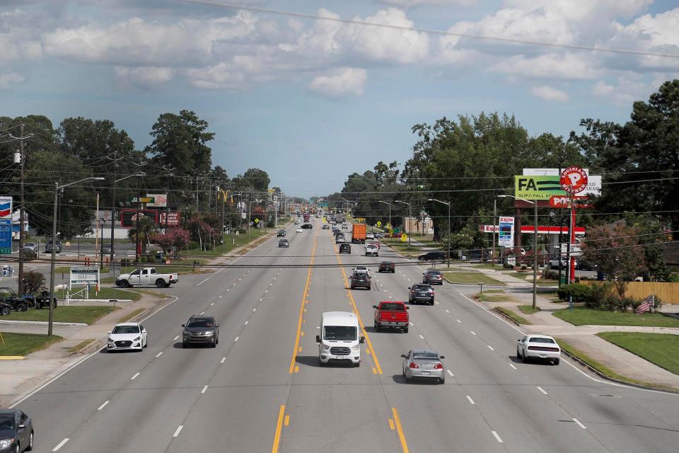 Traffic moves through Garden City on Highway 21.