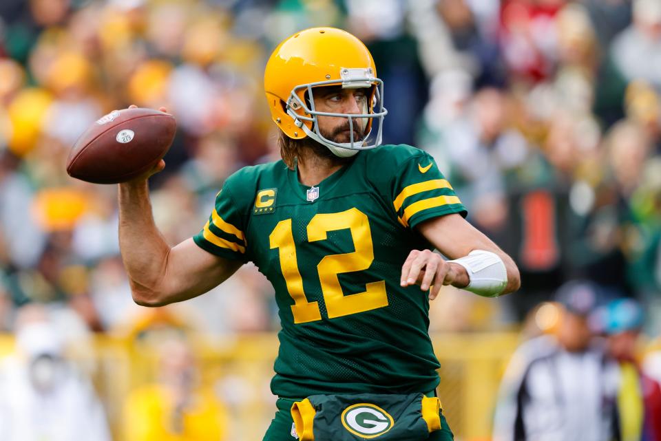 Green Bay Packers quarterback Aaron Rodgers (12) throws against the Washington Football team during an NFL football game Sunday, Oct 24. 2021, in Green Bay, Wis.