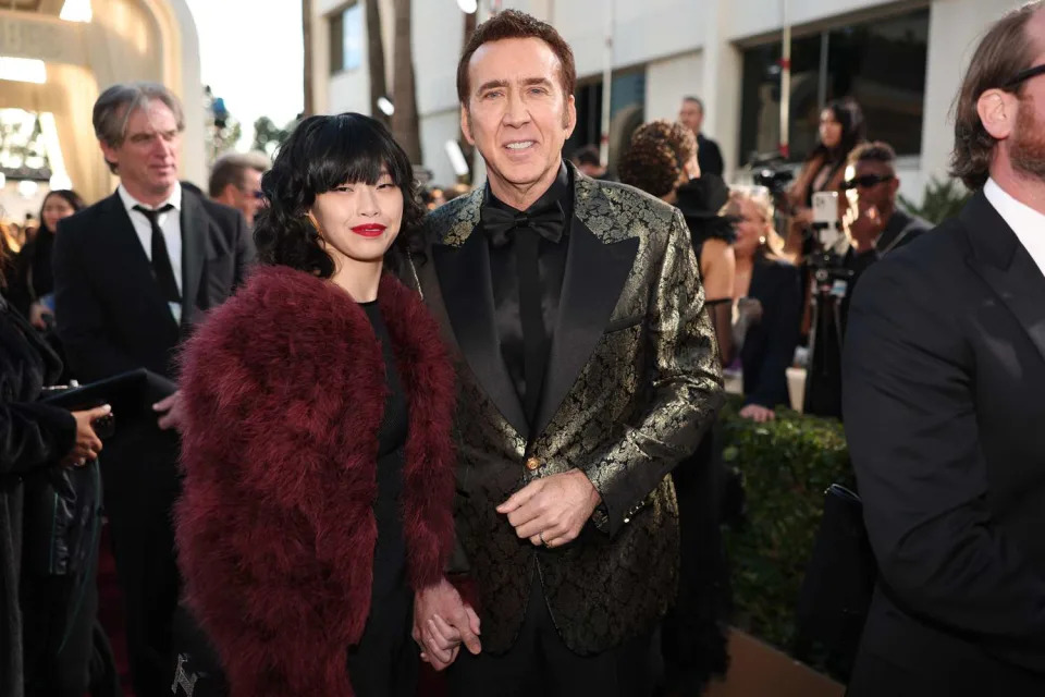 <p>Christopher Polk/Getty</p> Nicholas Cage and Riko Shibata