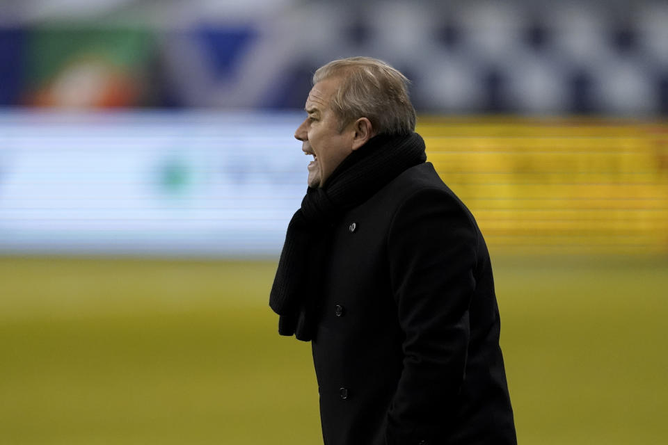 Minnesota United manager Adrian Heath watches during the second half of an MLS soccer match against Sporting Kansas City Thursday, Dec. 3, 2020, Kansas City, Kan. Minnesota won 3-0. (AP Photo/Charlie Riedel)