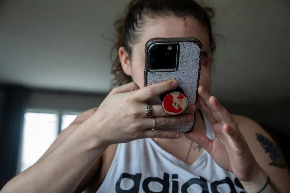 Amedy Dewey, 23, uses the microphone as she creates a message to send to her close friend inside her home in Scottville on Wednesday, June 28, 2023.