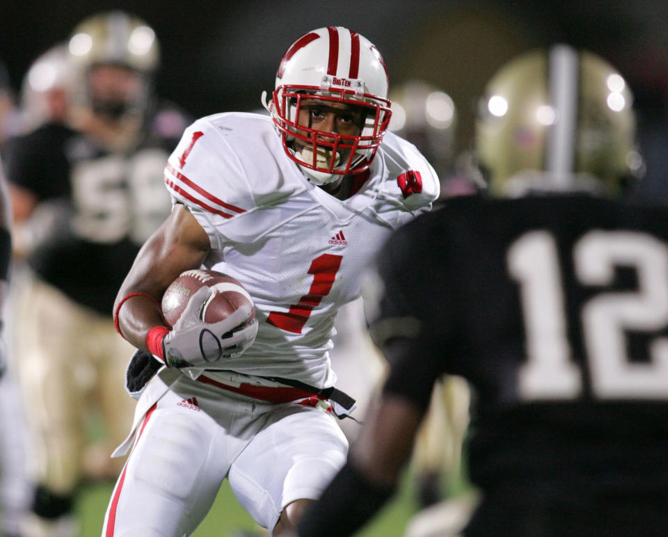 Oct 16, 2004; West Lafayette, IN, USA; University of Wisconsin #1 Brandon Williams runs against Purdue University #12 Antwuan Rogers. Mandatory Credit:Badgers beat the Boilermakers 20-17. Photo by Matthew Emmons-USA TODAY Sports (©) Copyright 2004 by Matthew Emmons