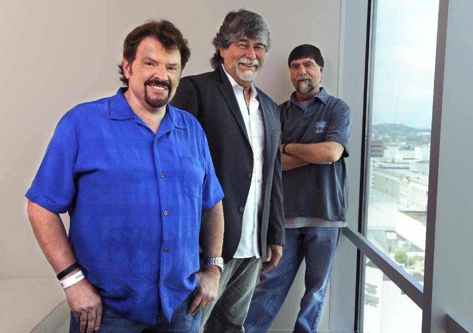 In this Tuesday, Aug. 13, 2013 photo, Jeff Cook, Randy Owen and Teddy Gentry from the American country music band Alabama pose for a portrait in Nashville, Tenn. Alabama has launched a tour and released a new album this week, “Alabama & Friends,” that features duets of the group’s biggest hits with top country stars. (Photo by Donn Jones/Invision/AP)