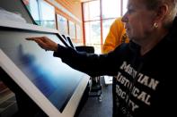 FILE PHOTO: Erika Still casts his vote on a new Election Systems & Software ExpressVote XL voting machine in Hanover Township