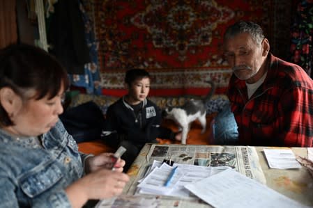 The Wider Image: Russian village's last teacher stays on for her one remaining pupil