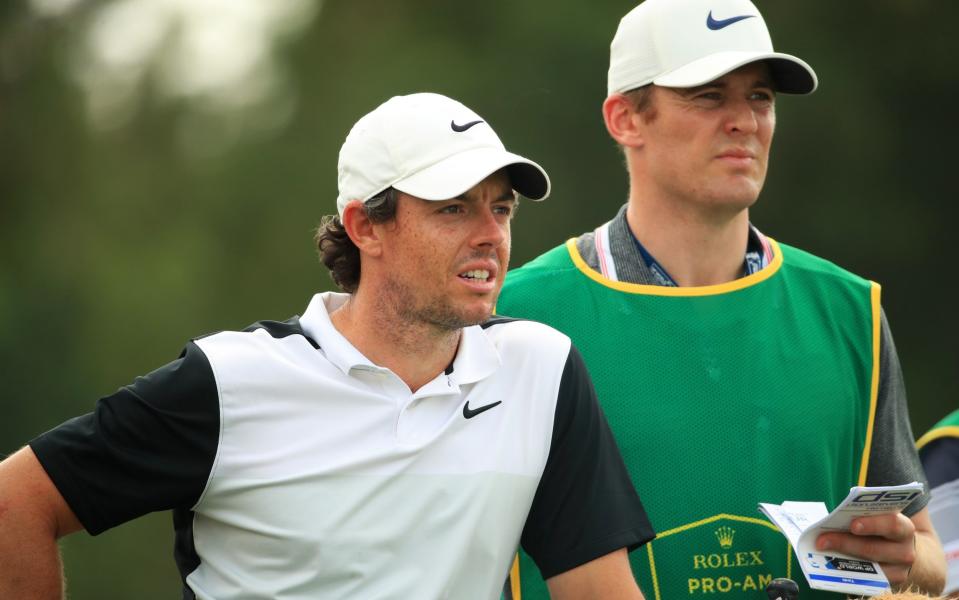 Rory McIlroy (left) is using his friend Niall O'Connor as a temporary caddy this week - Getty Images Europe