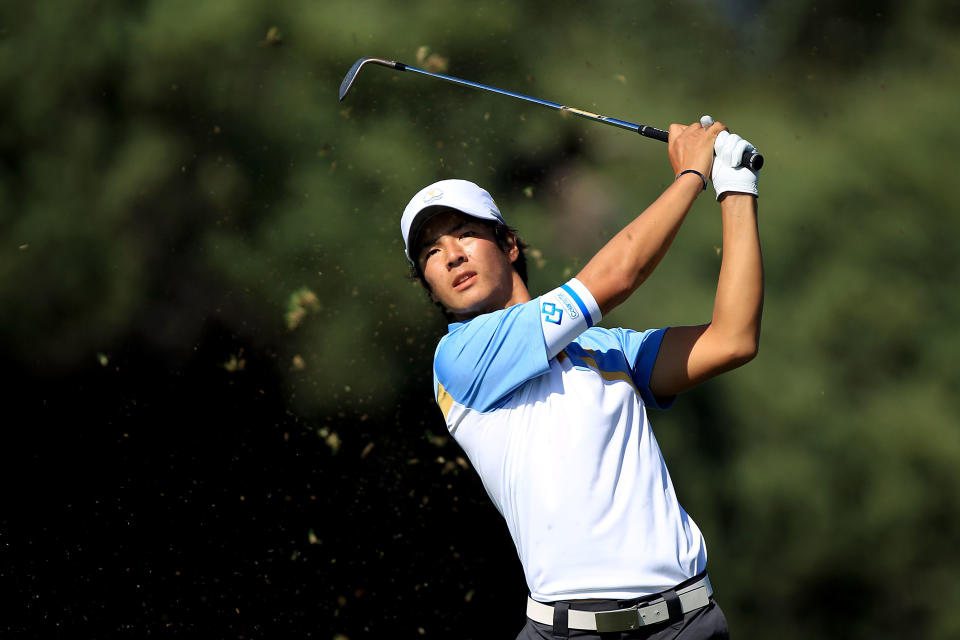 MELBOURNE, AUSTRALIA - NOVEMBER 18: Ryo Ishikawa of the International Team hits his second shot on the first hole during the Day Two Four-Ball Matches of the 2011 Presidents Cup at Royal Melbourne Golf Course on November 18, 2011 in Melbourne, Australia. (Photo by Scott Halleran/Getty Images)