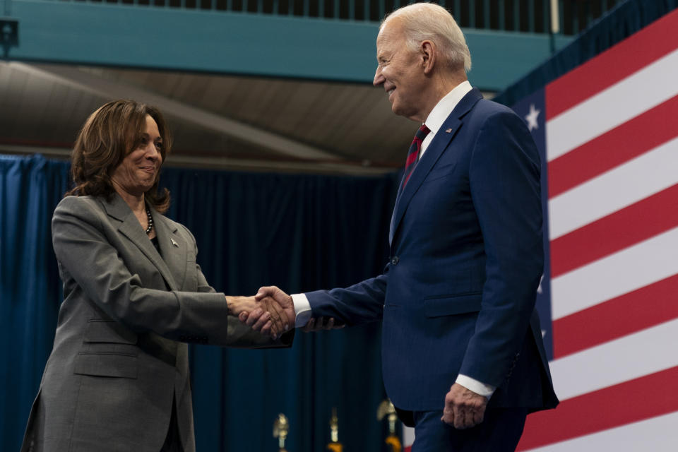 Vice President Kamala Harris, left, shakes hands with President Joe Biden, right, after introducing him at a campaign event in Raleigh, N.C., Tuesday, March 26, 2024. (AP Photo/Stephanie Scarbrough)