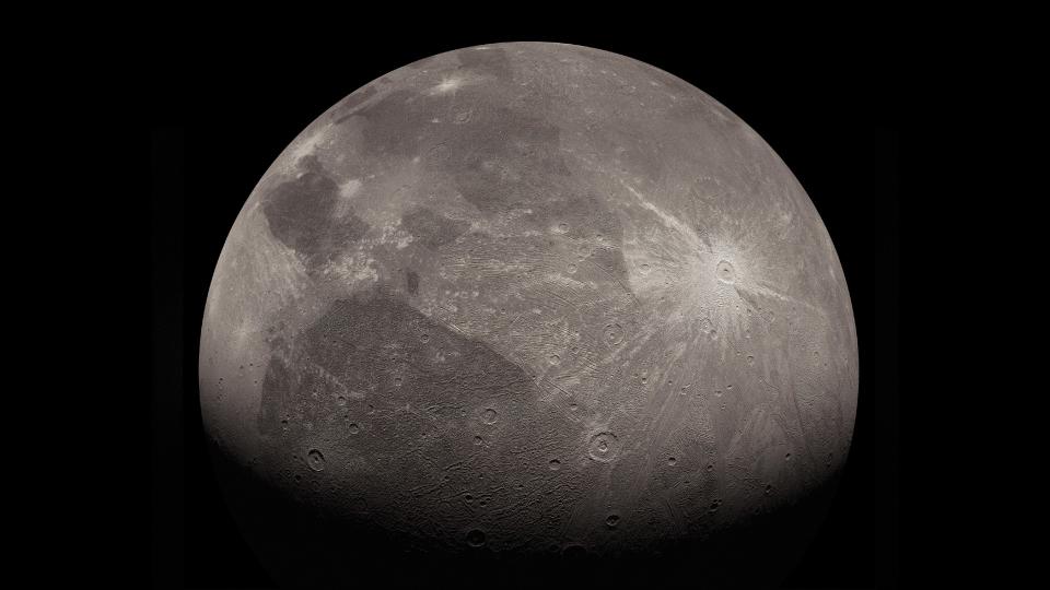  A gray moon pockmarked with craters. 