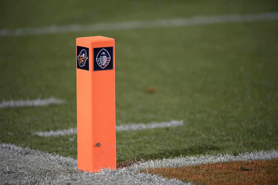 FILE - In this Feb. 9, 2019, file photo, logos for the Alliance of American Football, right, and the Orlando Apollos adorn an end zone pylon before an AAF football game between the Apollos and the Atlanta Legends on Saturday, Feb. 9, 2019, in Orlando, Fla. Almost no one knows the players, and there’s virtually no history to look back on. But that’s not stopping people from making bets on America’s newest professional football league, the Alliance of American Football. (AP Photo/Phelan M. Ebenhack, File)