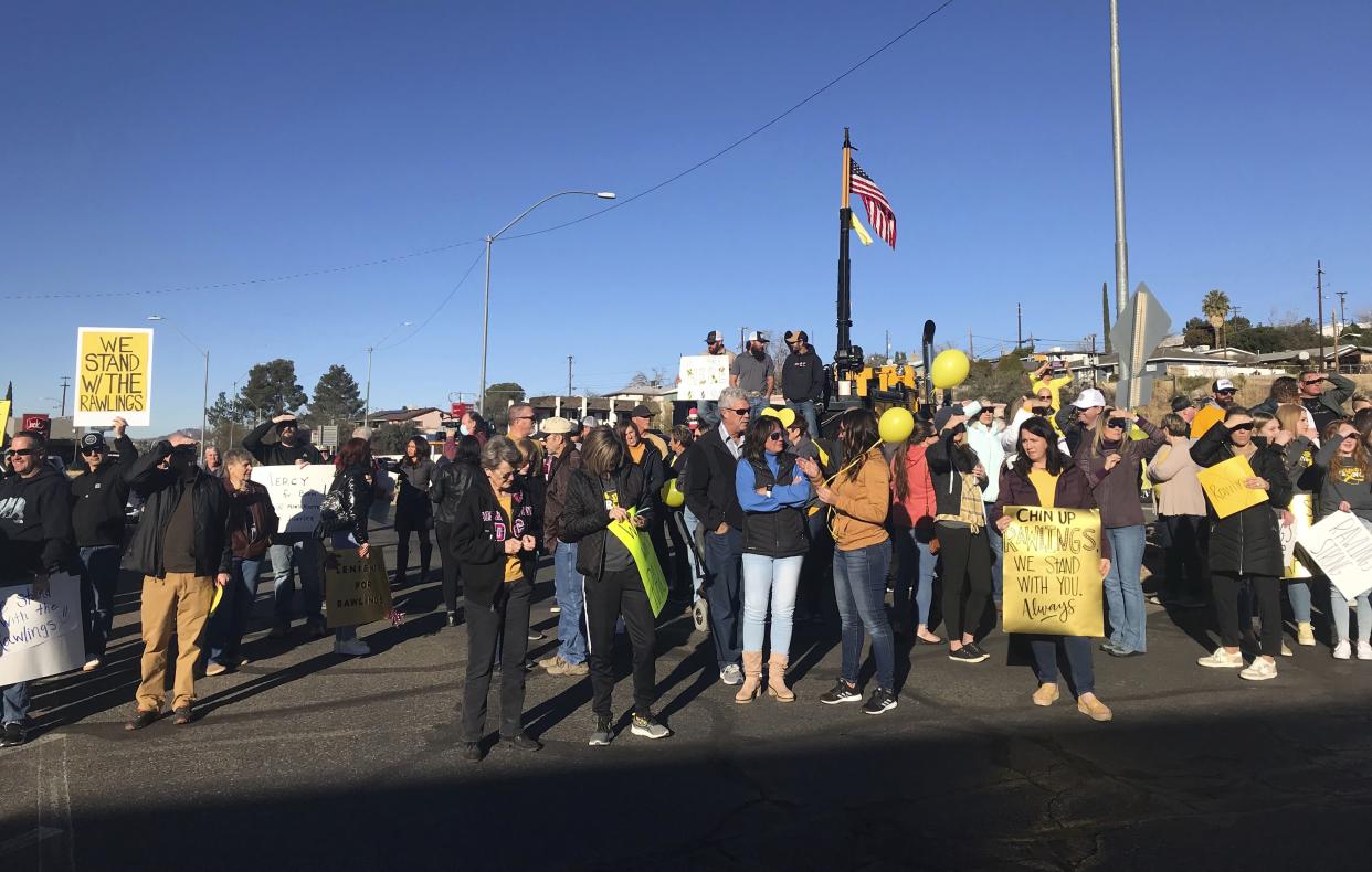 Supporters of Daniel and Lacey Rawlings gather in front of the Gila County Superior Court in Globe, Ariz., on Thursday, Jan. 27. The Rawlings drove around barricades and through a flooded wash on Nov. 29, 2019. The vehicle got stuck, and two of their children and a niece were swept away and drowned. 