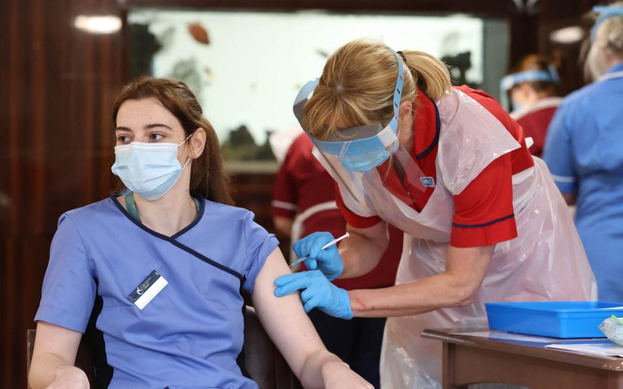 Care home staff receive the Pfizer/BioNtech Covid-19 vaccine at Bradley Manor residential care home in Belfast - PA