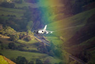 <p>A plane flies through a rainbow in Wales. (Photo: Caters News) </p>