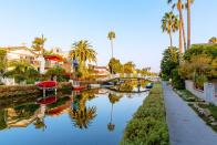 <p><strong>Venice Canals</strong></p><p>Visiting the <a href="https://www.visitveniceca.com/2015/07/23/venice-canals/" rel="nofollow noopener" target="_blank" data-ylk="slk:Venice Canals;elm:context_link;itc:0;sec:content-canvas" class="link ">Venice Canals</a> in Venice, California, makes you feel like you’re in Europe (except with palm trees). Made up of six waterways–Carroll, Linnie, Howland, Sherman, Eastern, and Grand and approximately one and a half miles in length–the canals are perfect for a self-guided bike or walk.</p>