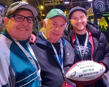 Michael Polin, a speech language pathologist at Stewart Elementary, with dad Gary Polin and brother-in-law Yonah Korngold. The family received a memento Eagles football before last Sunday night’s Dolphins-Eagles game as "Season Ticket Members of the Game."