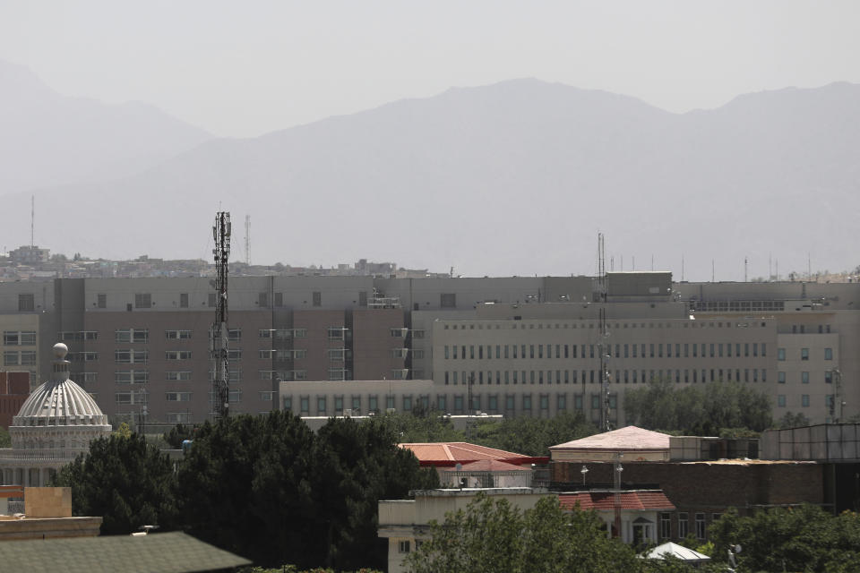 The U.S. Embassy buildings, center, are seen in Kabul, Afghanistan, Saturday, Aug. 14, 2021. The last-minute decision to send 3,000 U.S. troops to Afghanistan to help partially evacuate the U.S. Embassy is calling into question whether President Joe Biden will meet his Aug. 31, deadline for fully withdrawing combat forces. The vanguard of a Marine contingent arrived in Kabul on Friday and most of the rest of the 3,000 are due by Sunday. (AP Photo/Rahmat Gul)