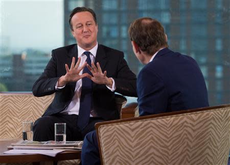 Britain's Prime Minister David Cameron speaks as he appears on the BBC's Andrew Marr Show, on the first day of the of the Conservative Party annual conference in Manchester, northern England September 29, 2013. REUTERS/Stefan Rousseau/Pool