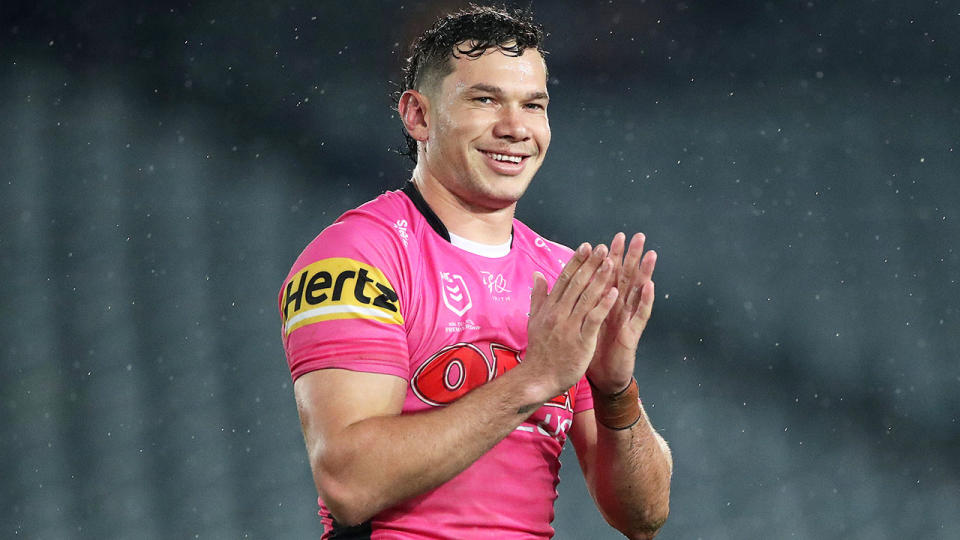 Brent Naden (pictured) claps during an NRL match.