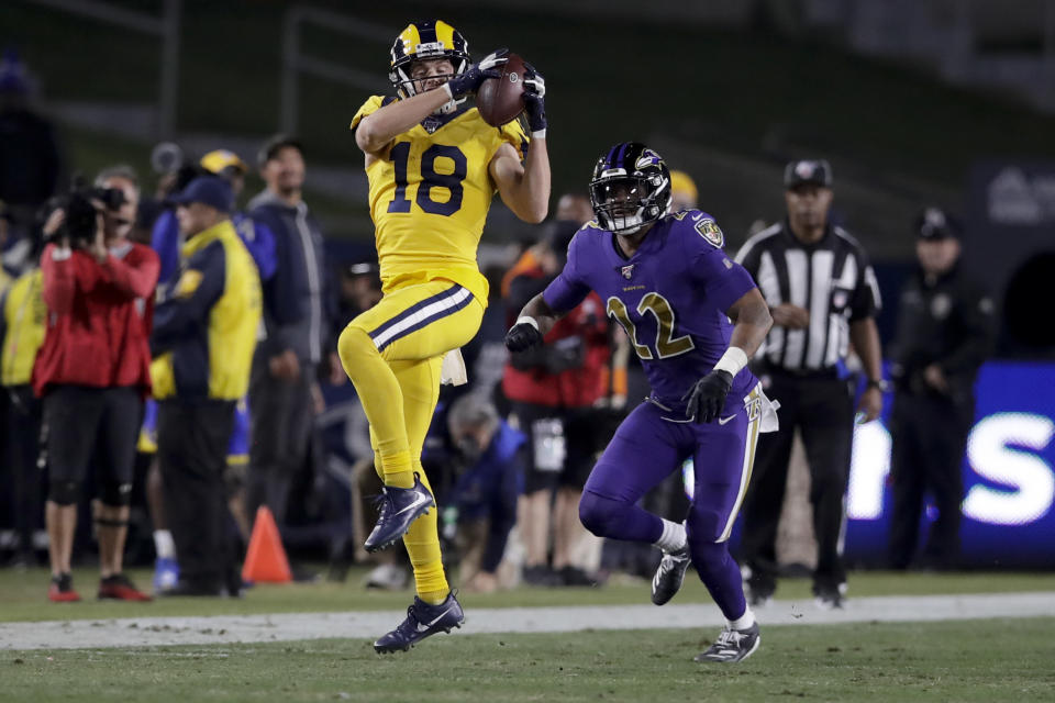 Los Angeles Rams wide receiver Cooper Kupp catches a pass in front of Baltimore Ravens cornerback Jimmy Smith during the second half of an NFL football game Monday, Nov. 25, 2019, in Los Angeles. (AP Photo/Marcio Jose Sanchez)