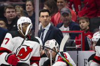 New Jersey Devils interim coach Alain Nasreddine watches during the second period of an NHL hockey game against the Washington Capitals, Thursday, Jan. 16, 2020, in Washington. (AP Photo/Al Drago)