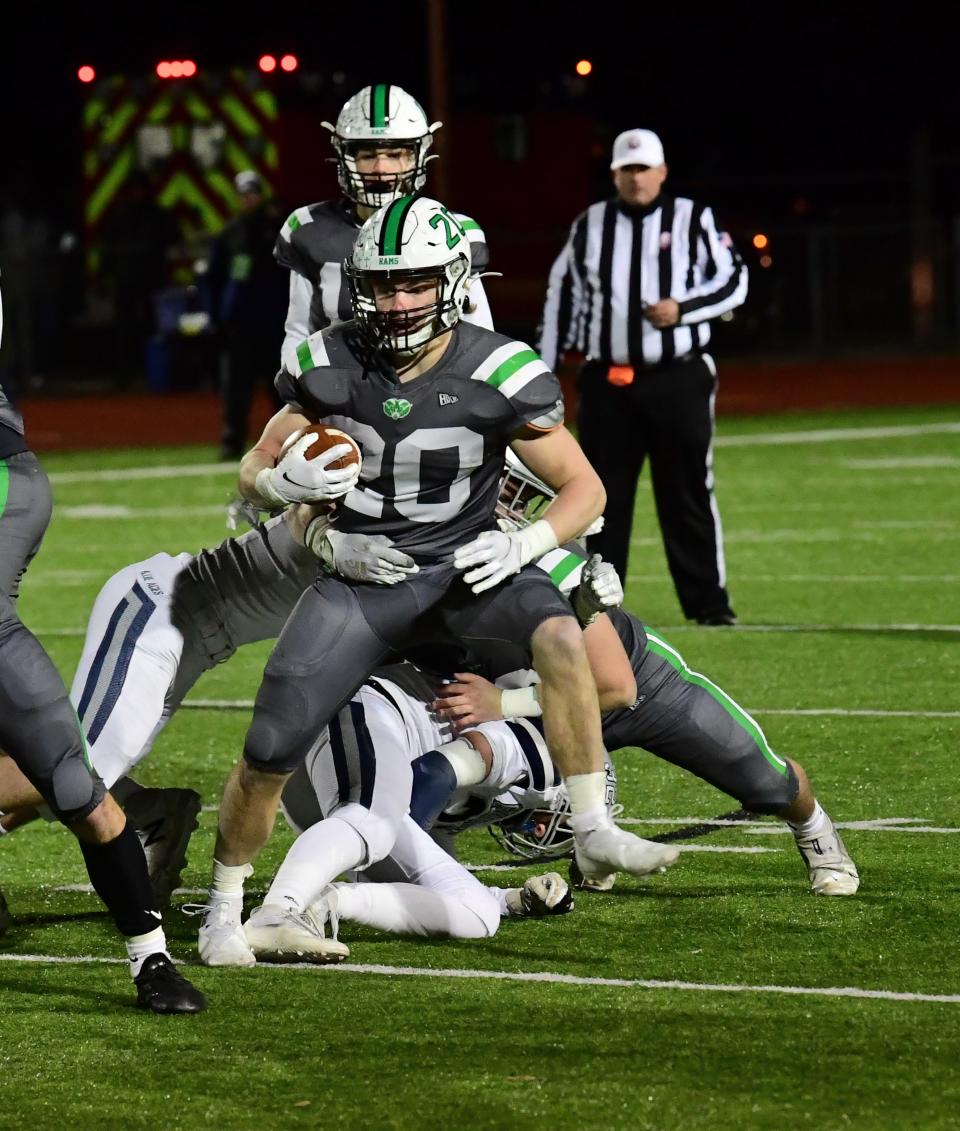 Badin's Jack Walsh (20) breaks free from the Granville defense and picks up first-down yards at the OHSAA Division III state football semifinals, Nov. 26, 2021.
