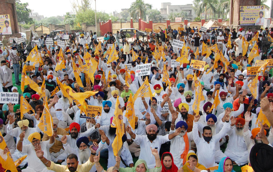 AMRITSAR, INDIA SEPTEMBER 25: Shiromani Akali Dal (SAD) leaders and workers raise slogans and block the road at Golden Gate during Punjab bandh, a statewide farmers' strike against the recent passing of agriculture reform bills in the Parliament, on September 25, 2020 in Amritsar, India. The two bills - the Farmers (Empowerment and Protection) Agreement on Price Assurance and Farm Services Bill, 2020 and the Farming Produce Trade and Commerce (Promotion and Facilitation) Bill, 2020 - were passed by the Rajya Sabha despite uproar and strong protest by the Opposition parties in the house. (Photo by Sameer Sehgal/Hindustan Times via Getty Images)