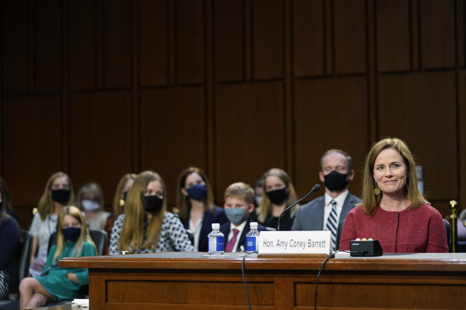 Barrett's husband sits behind her during Tuesday's committee hearing, along with some of the couple's seven children. (Photo: (AP Photo/Patrick Semansky, Pool))