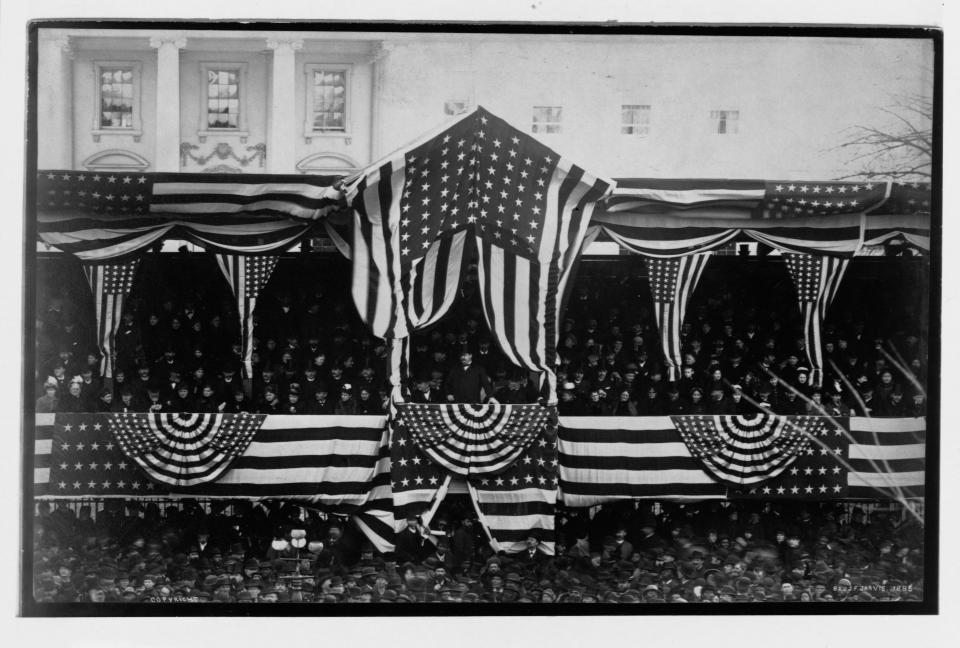 Grover Cleveland stands at the center of&nbsp;the crowded grandstand erected for his first inauguration in March 1885.