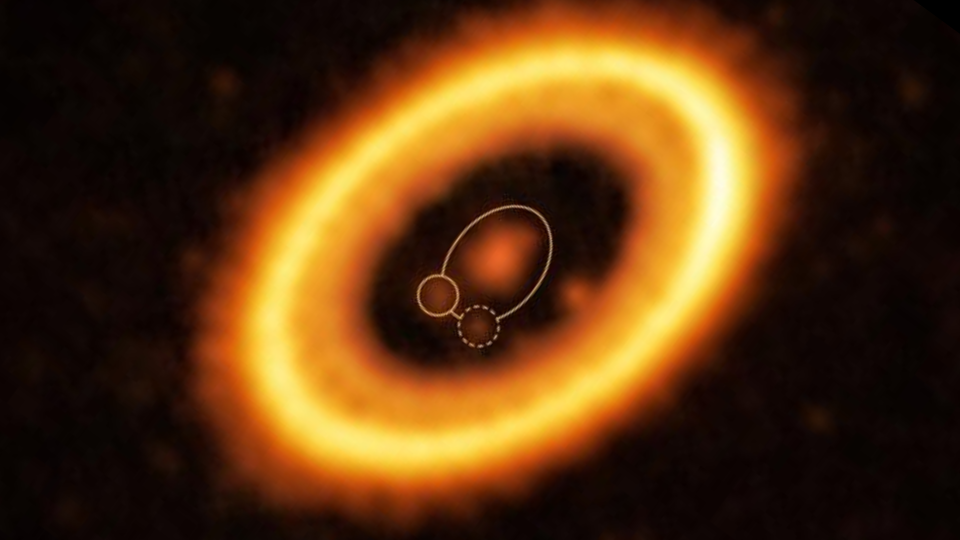 fuzzy orange, concentric rings surround a central star in deep space.