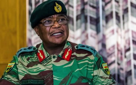 Zimbabwe Army General Constantino Chiwenga Commander of the Zimbabwe Defence Forces addresses a media conference held at the Zimbabwean Army Headquarters on November 13, 2017 in Harare - Credit:  AFP