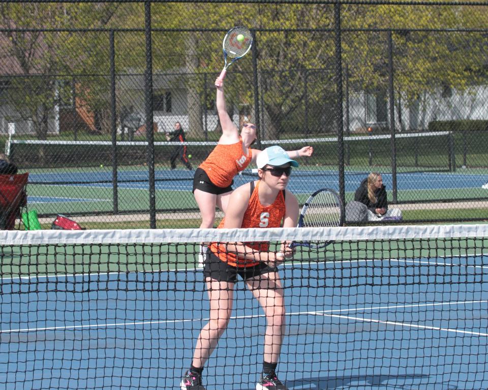 Sturgis' Johanna Rooyakkers serves behind first doubles teammate Madison Golden in prep tennis action on Monday.