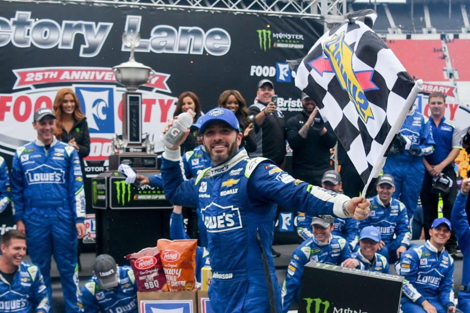 NASCAR Cup Series driver Jimmie Johnson celebrates in victory lane after winning the Food City 500 at Bristol Motor Speedway in 2017.