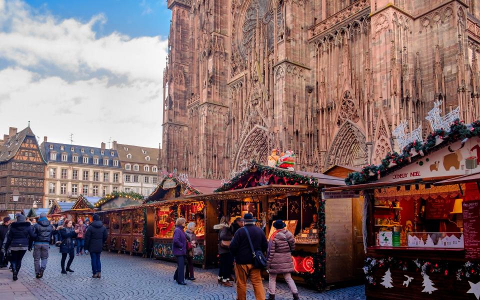 People at the Christmas market on the Place de la Cathedrale in Strasbourg