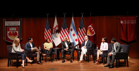 Former U.S. President Barack Obama (C) meets with youth leaders Kelsey McClear (L) from Loyola University, Ramuel Figueroa (2nd L) from Roosevelt University, pharmacist Dr. Tiffany Brown (3rd L), Max Freedman (3rd R) from University of Chicago, Ayanna Watkins (2nd R) from Kenwood High School and Harish Patel (R) from New America Foundation at the Logan Center for the Arts at the University of Chicago to discuss strategies for community organization and civic engagement in Chicago, Illinois, U.S., April 24, 2017. REUTERS/Kamil Krzaczynski REUTERS/Kamil Krzaczynski