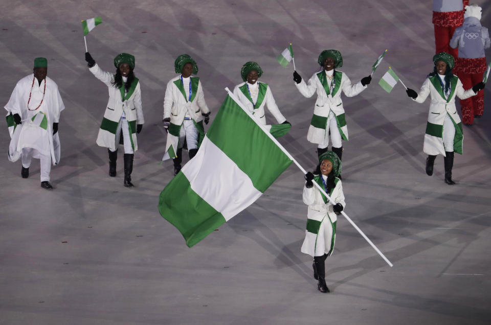 <p>Ngozi Onwumere carries the flag of Nigeria during the opening ceremony of the 2018 Winter Olympics in Pyeongchang, South Korea, Friday, Feb. 9, 2018. (AP Photo/Natacha Pisarenko) </p>