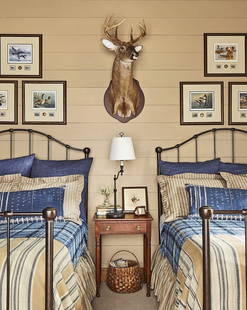 bedroom with tan walls and blue and tan bedding