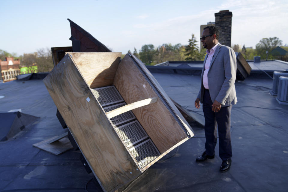 Wali Dirie, executive director of the Islamic Civic Society of America Dar Al-Hijrah mosque, opens rooftop speakers used to publicly broadcast the Islamic call to prayer, or adhan, on Thursday, May 12, 2022, in Minneapolis. During the pandemic lockdown in spring 2020, the mosque was given a special permit to broadcast the prayer for the Muslim holy month of Ramadan. That led to a recent resolution authorizing mosques to broadcast the adhan three times a day. (AP Photo/Jessie Wardarski)