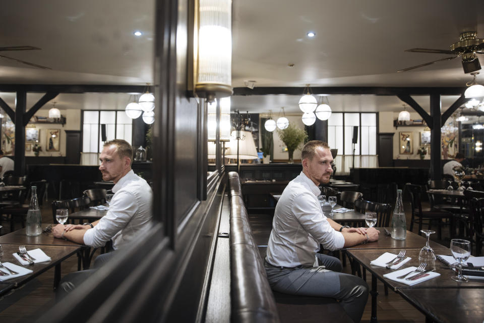 Russian paratrooper Pavel Filatiev speaks during an interview in Paris on Tuesday, Sept. 6, 2022, after publishing a journal about his experience fighting in Ukraine. Pavel Filatiev was part of a Russian unit that seized the Ukrainian port city of Kherson early in the war. (AP Photo/Lewis Joly)