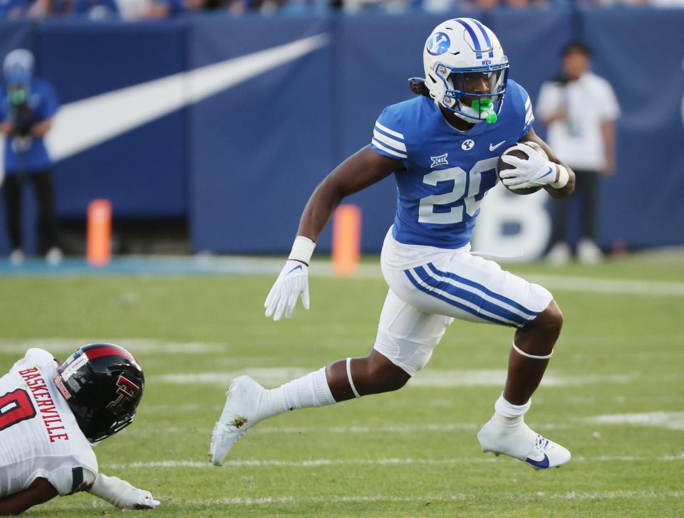 Brigham Young Cougars running back Deion Smith (20) runs against the Texas Tech Red Raiders in Provo on Saturday, Oct. 21, 2023. BYU won 27-14. | Jeffrey D. Allred, Deseret News