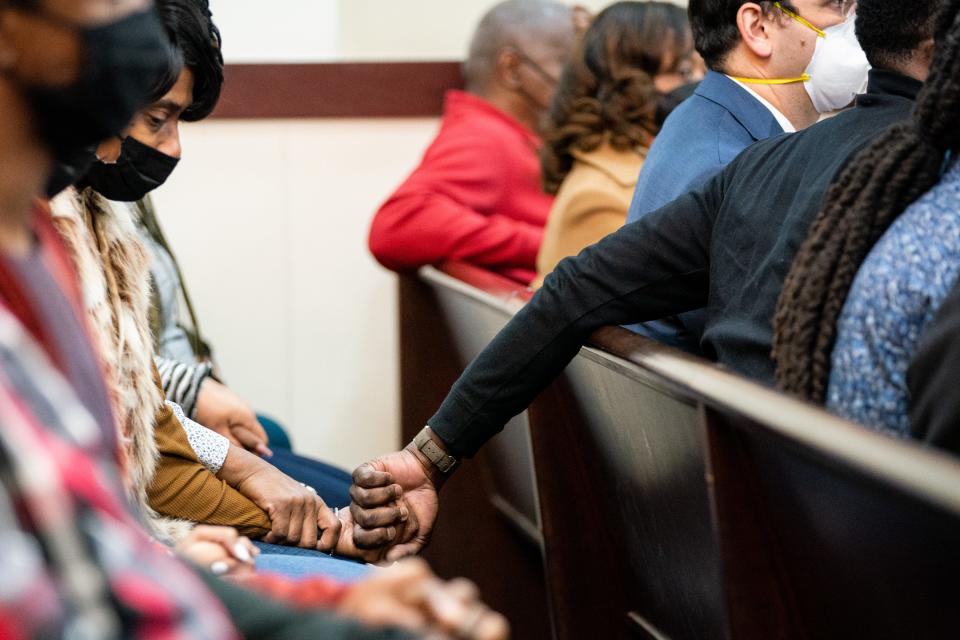 James Shaw Jr., who disarmed Travis Reinking during the Waffle House shooting, holds hands with Shirl Baker, mother of victim DeEbony Groves, after the verdict is read Friday on the fifth day of Reinking’s murder trial at the Justice A.A. Birch Building in Nashville. A jury found Reinking guilty of four counts of first-degree murder and 12 additional related charges.