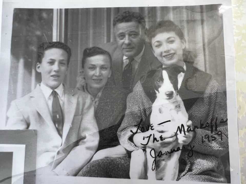 The Markoff Family is shown in a black and white picture. The two young parents and young teens are well dressed. Betty Markoff is holding a dog. A note reads The Markoffs January 1959