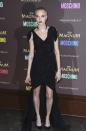 <p>The shaven-headed model donned an asymmetric Moschino dress and dark berry lipstick.<br><i>[Photo: AP]</i> </p>