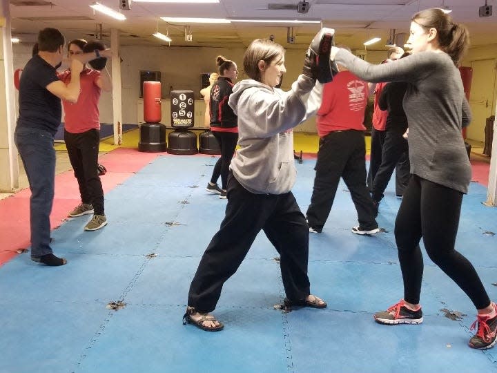 The Threat Response Training Group offers a four week self defense course.  Here attendees practice strikes.