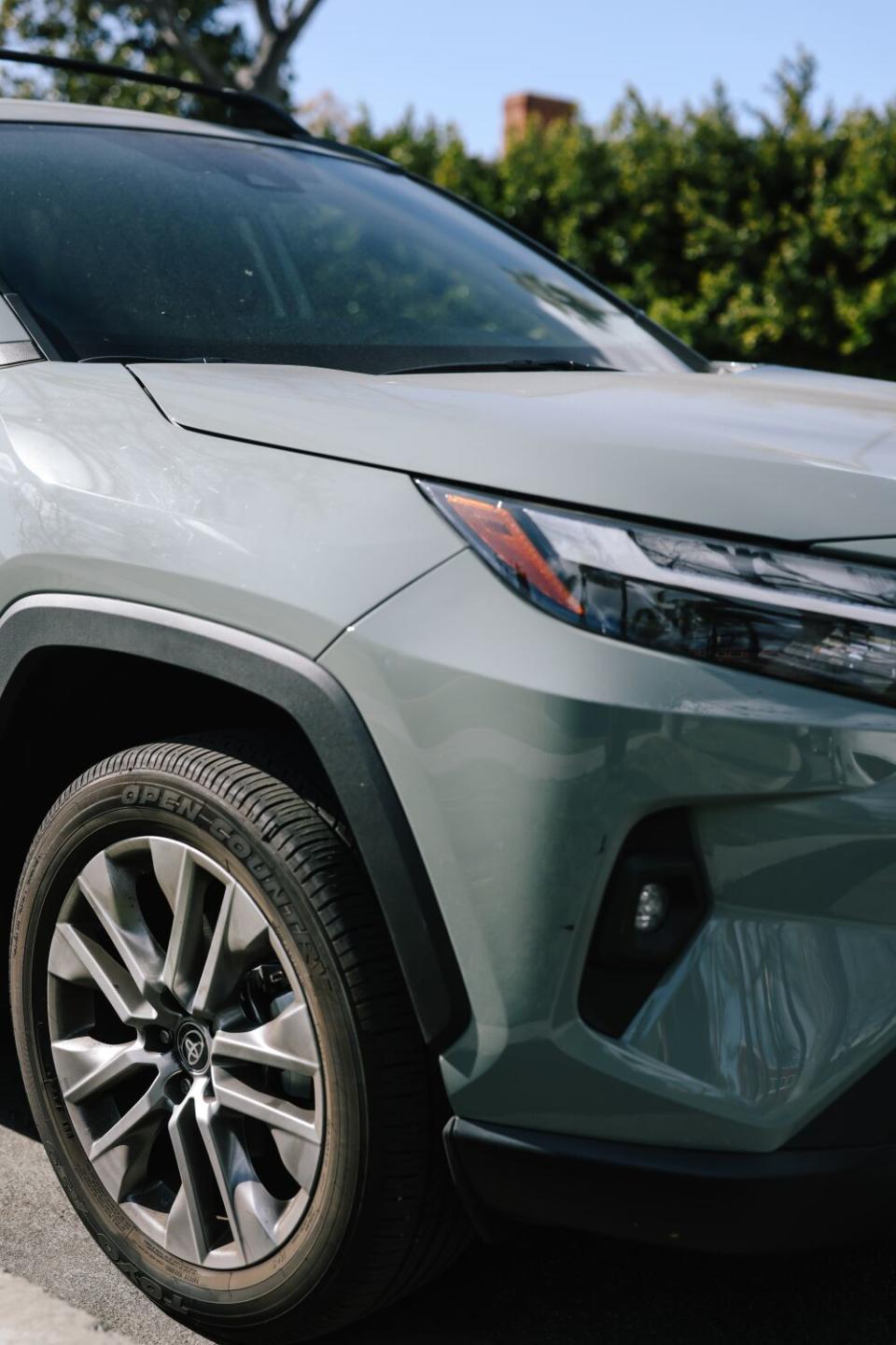 A Toyota RAV4, painted a muted, earthy hue