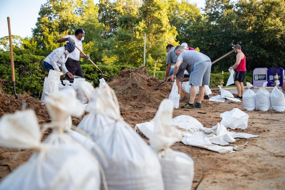 Tallahassee residents fill sandbags as they prepare for the worst with Hurricane Idalia heading toward Florida on Aug. 29, 2023.