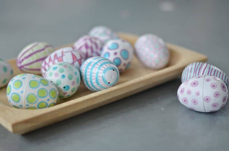 Easter eggs in wooden tray.
