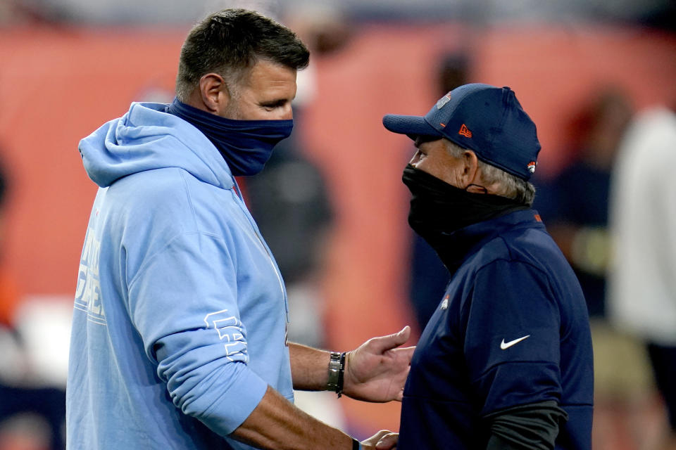 Tennessee Titans head coach Mike Vrabel, left, greets Denver Broncos head coach Vic Fangio prior to an NFL football game, Monday, Sept. 14, 2020, in Denver. (AP Photo/David Zalubowski)